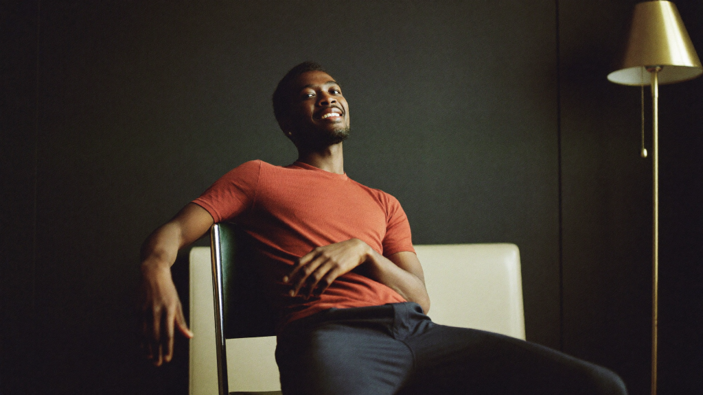 Independent artist sitting back relaxed in a chair in his home studio